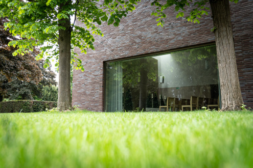 Light enters the new mourning hall through large windows.