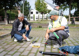 Installation of new sensors in the car park on Theodor-Heuss-Ring Hany Omar (left) is observing Mentor Sinani as he installs the smart sensors in the car park on Theodor-Heuss-Ring.
