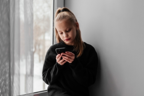 Young girl with smartphone