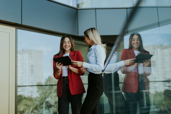 two-business-women-collaborating-outdoors-with-dig-2024-06-11-03-24-11-utc